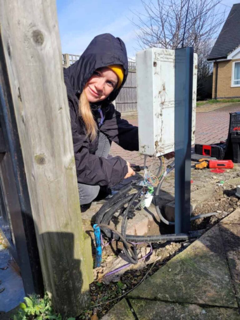 gate fixers engineer repairing a gate control board and wiring